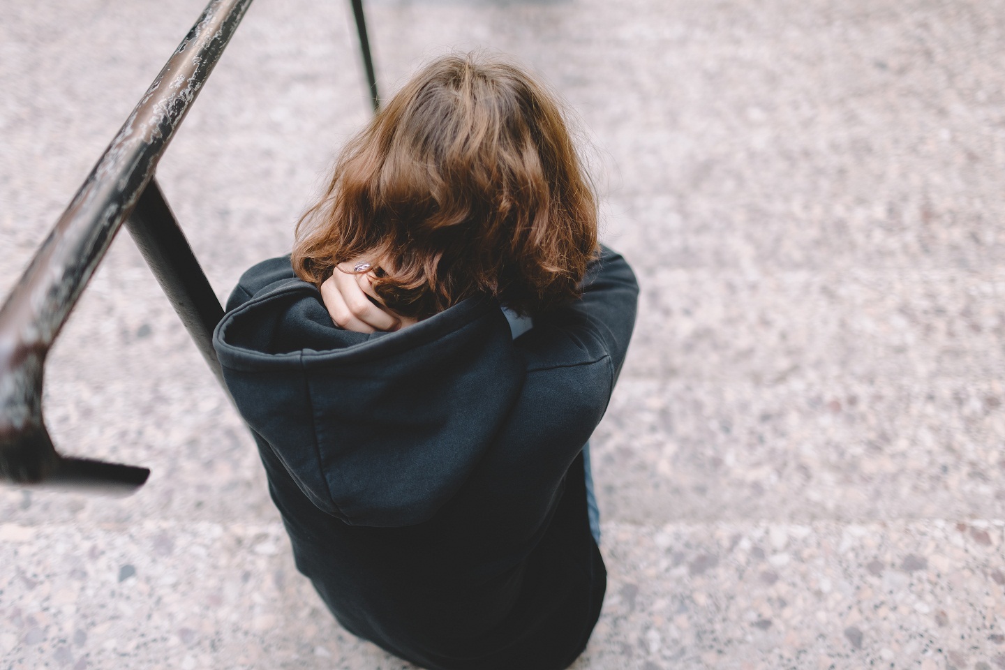 depressed teenage girl sitting on steps