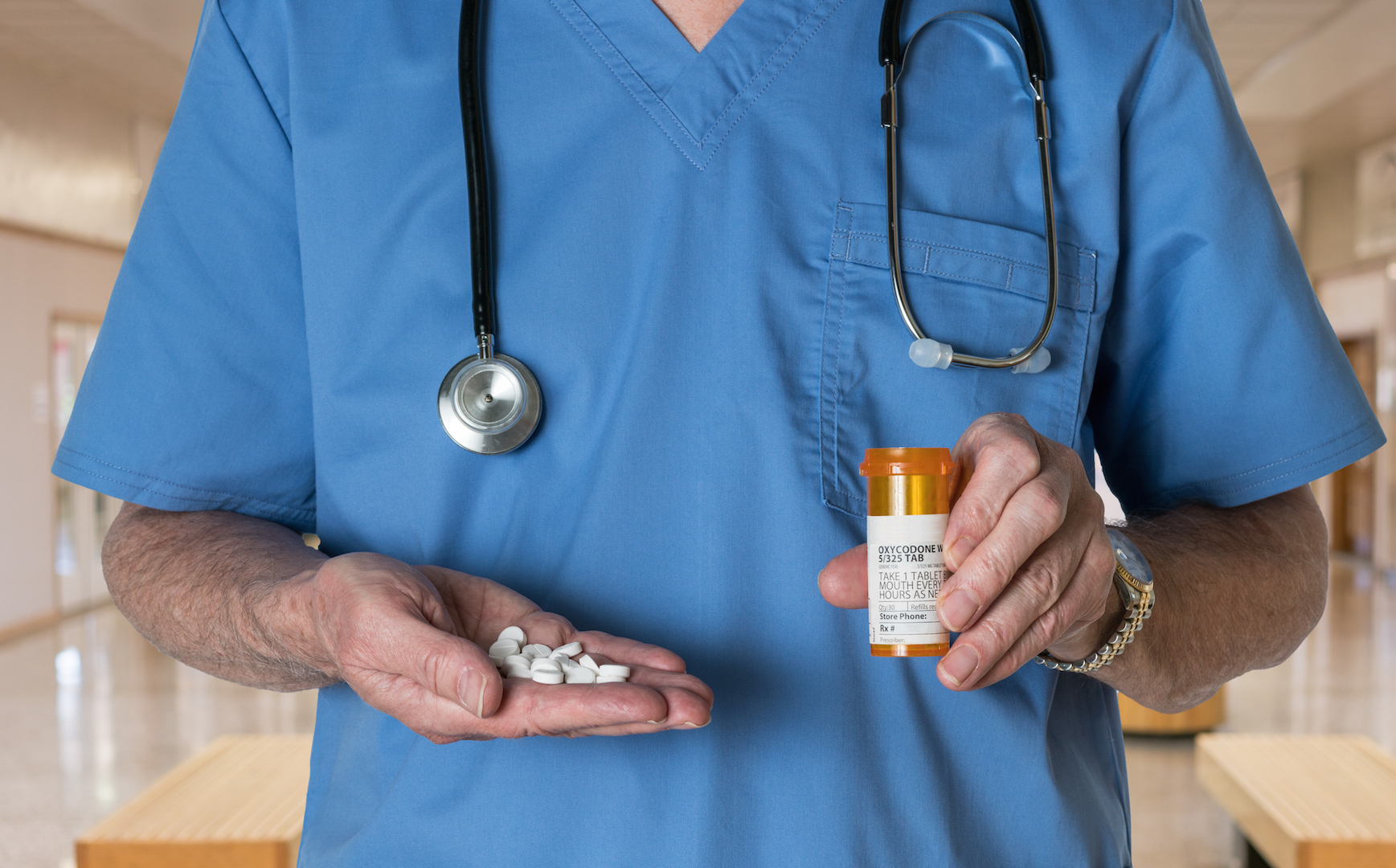 doctor holding pills