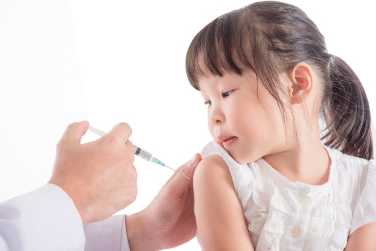 Girl getting vaccinated in China