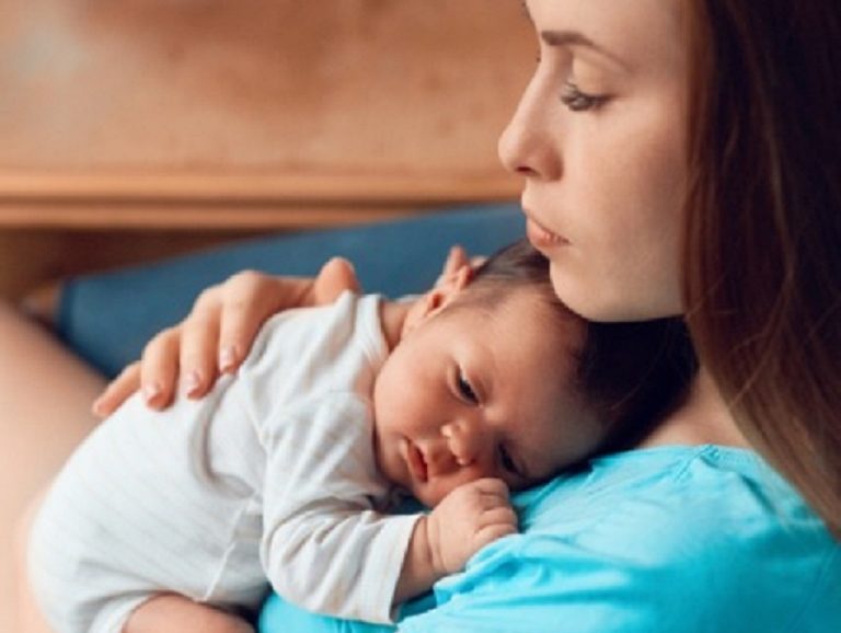 mother holding baby