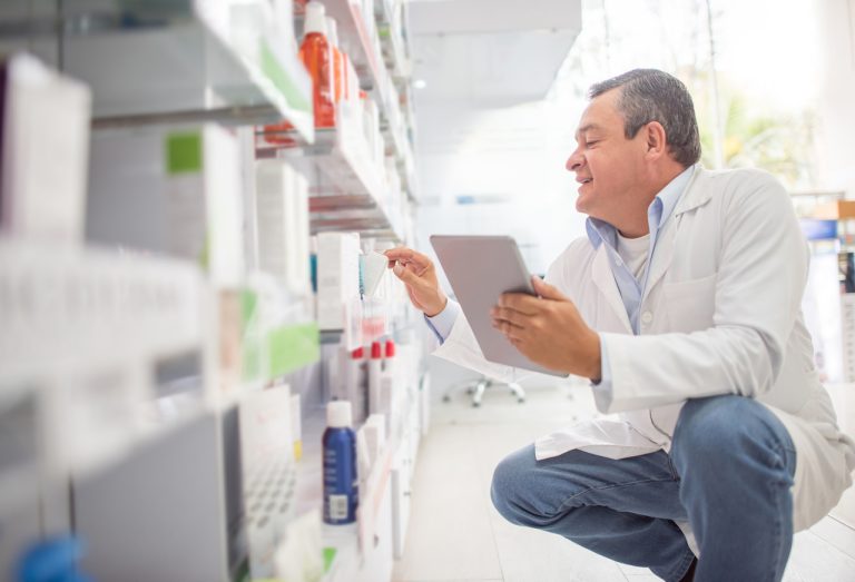 pharmacist stocking shelves