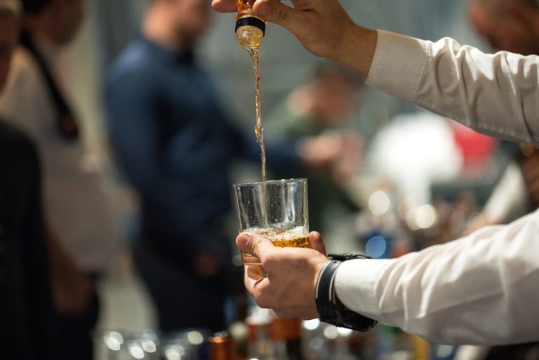 pouring alcohol into glass