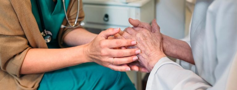 holding hand of elderly person