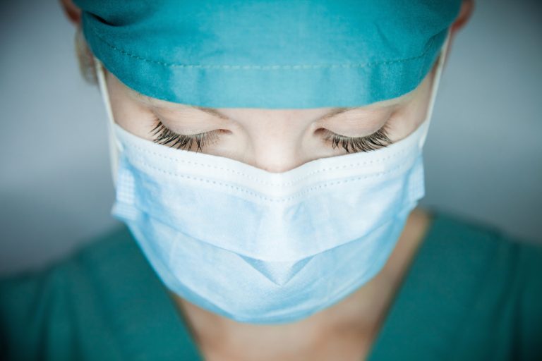 female health care worker looking down