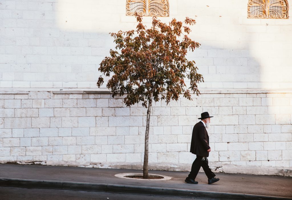 elderly man walking in Jerusalem
