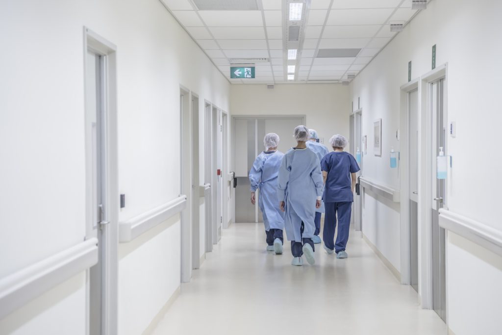 hospital workers walking in hospital
