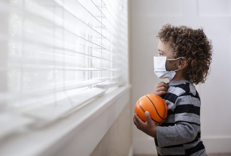 little boy looking out window