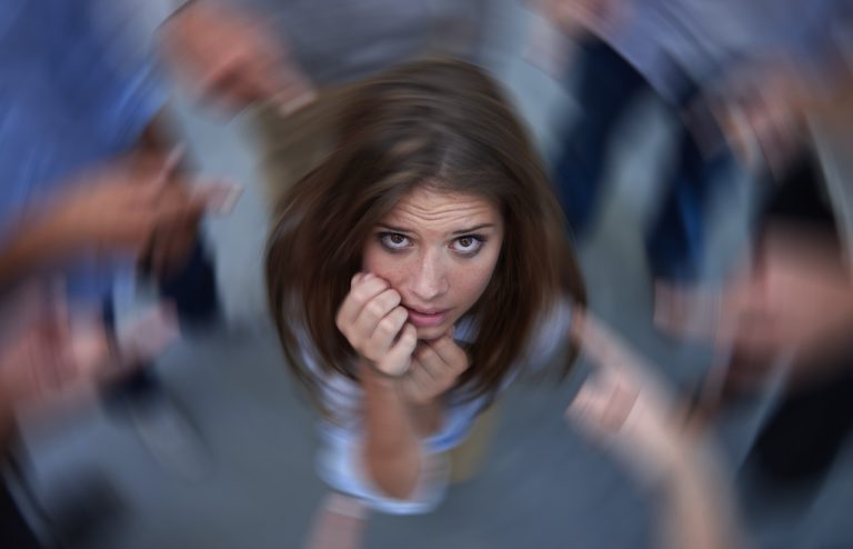 woman surrounded by accusers