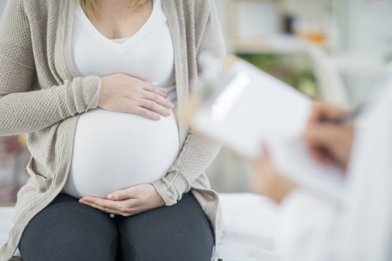 pregnant mother holding belly