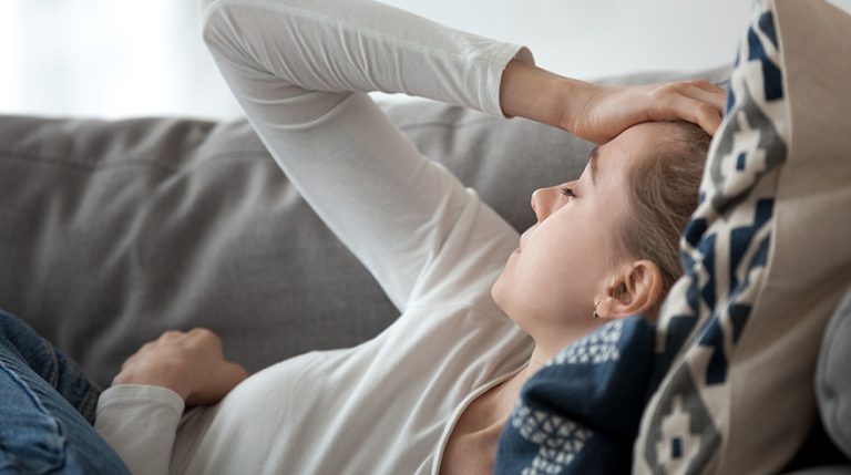 woman laying on couch