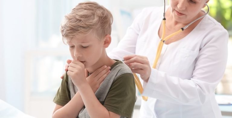 boy being examined by doctor