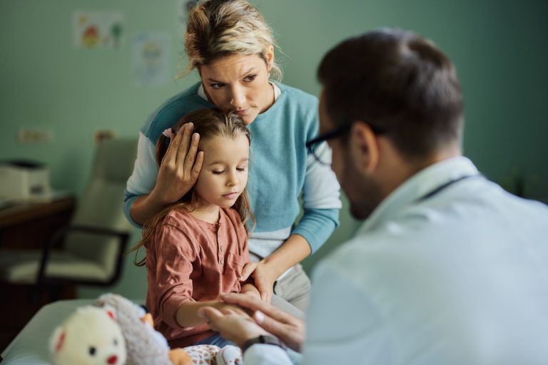 mother and daughter with pediatrician