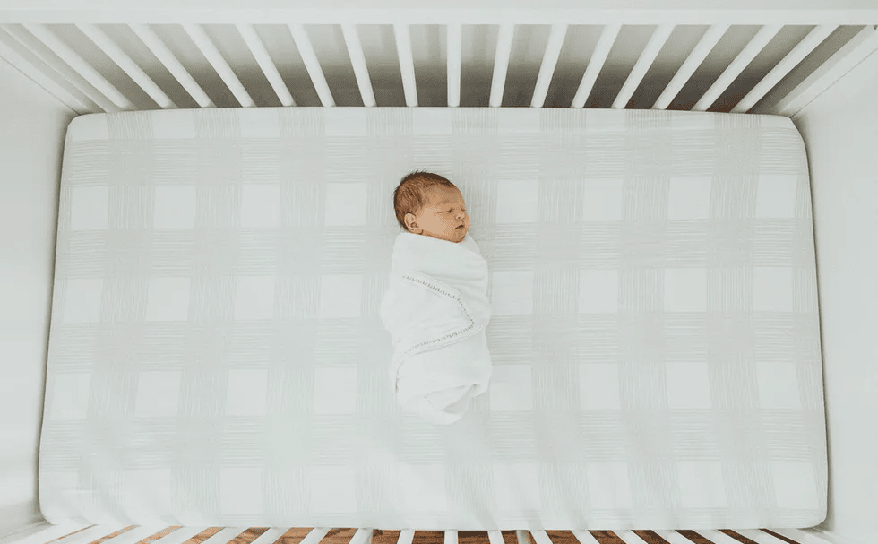 baby lying in crib